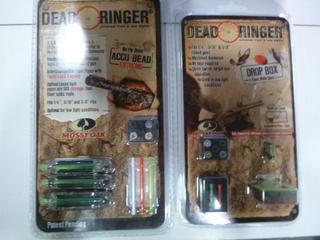 (1) Dead Ringer Drop Box Mossy Oak Green/Orange Sights, and (1) Dead Ringer Accu Bead Extreme Mossy Oak Front Sight (Upstairs)