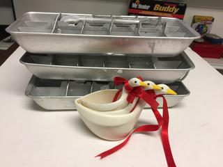 (3) Aluminum Ice Trays & (3) Swan Measuring Cups.
