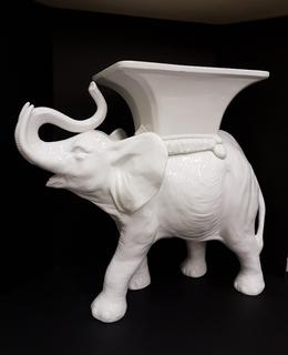 Italian Hand Cast High Gloss White Porcelain Elephant Occasional Table (15"W x 34"L x 27.5"H). No portion of the proceeds for this lot will be donated to Alberta Ballet.