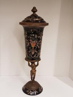 Hand Cast Bronze Black Enameled Urn with Hand-painted Pink Floral/Scroll Design and Bronze Cherub Pedestal Base (7.5"W x 24"H).  No portion of the proceeds for this lot will be donated to Alberta Ballet.