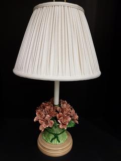 Italian Hand Cut Porcelain Lamp with Rose & Green Floral Bundle and Ivory Pleated Silk Lampshade (14.5"W x 24"H).  No portion of the proceeds for this lot will be donated to Alberta Ballet.