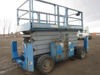 2005 Genie GS-5390 4x4 R/T Scissor Lift c/w 3 Cyl Diesel, Rated Work Load 1500 LBS, 16' Length, Outriggers. Showing 3,056 Hours. S/N GS9005-42316