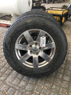 (5) Bridgestone Dueller A/T P255/70R18 Tires w/Jeep 5 x 5 Bolt Pattern Rims (fit 2015 Jeep Wrangler or equal), 44.45 offset. Spare tire has never been used. 