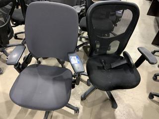 (1) Mesh Back & (1) Vinyl. Vinyl chair has adjustable arm pads. Mesh back chair has damaged arm rest.