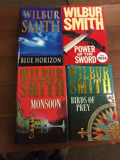 (4) Wilbur Smith Books.