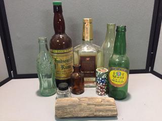 Assorted Glass Bottles, Poker Chips and Petrified Wood.