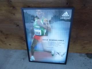 29in X 21in Haile Gebrselassie Adidas Signed Photo *Note: Crack On Frame, No COA*