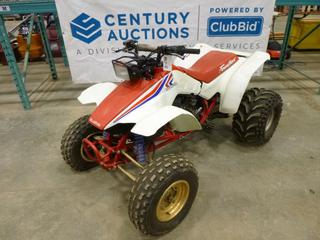 1987 Honda TRX250R ATV c/w 250R, 21x7-10 Front Tires- Needs Replacing, 22x12.5-8 Rear Tires at 75%, 2 Stroke, VIN JH3TE120XHK104184 *Note: Turns Over, Running Condition Unknown*
