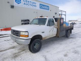 1997 Ford F-350 XL 4X4 Flat Deck Truck Regular Cab, c/w 7.5L V8, A/T, A/C, Showing 223,670 Kms, GVWR 11,000 Lb, 235/85R16 Tires at 60%, Dually, Headache Rack, Storage Cabinet, Accutrac Brake Control, VIN 1FDKF38G5VEB72461 *Note: No Driver Side Door Handle On Inside*