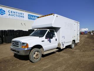 2000 Ford F-450 Super Duty XL Utility Truck c/w 6.8L Triton ZV10, A/T, A/C, Showing 241,386 Kms, Walk Through Storage and Shelving, Propane Hook Up For Power, 255/70R19.5 Front Tires at 30%, Dually Rears at 40%, Front Axle Rating 5,600 Lb., Rear Axle Rating 11,000 Lb., 15 Ft., VIN 1FDXF46S7YEE38747 *Note: Damage and Rust*