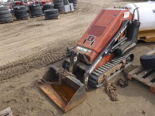 Ditch Witch SK650 Stand On Skid Steer c/w 1,722 Hours, 36 In. Bucket, 7 In. Tracks at 40% *Note: Does Not Run, Motor Blown, No Battery, Unable To Verify SN*