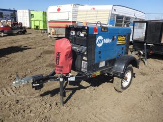 Miller Big Blue 300 DC Welding Generator c/w Perkins 403C-15 Diesel Engine, Showing 3,020 Hours, 2 In. Ball, ST175/80D13 Tires, VIN 5DLBUB819CH004446  (East Fence)