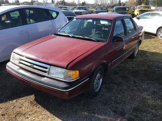 Selling Off-Site -  1989 Ford Tempo 4 Door Car c/w 4 Cyl, Auto, With Key, Showing 125,270 Kms, VIN 2FABP35XXKB226081.  Location - 527 North 200 East, Raymond, AB -  For Further Information Please Call Chris 403-308-1161.