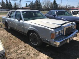 Selling Off-Site -  1989 Lincoln Town Car  c/w V8, Auto, No Key, Showing 340,680 Kms, For Parts, VIN 1LNBM82F4KY812219. Location - 527 North 200 East, Raymond, AB -  For Further Information Please Call Chris 403-308-1161.