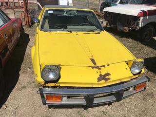 Selling Off-Site -  1977 Fiat X19 Car c/w 4 Cyl, Std, No Key.  VIN 128AS0038051. Location - 527 North 200 East, Raymond, AB -  For Further Information Please Call Chris 403-308-1161.