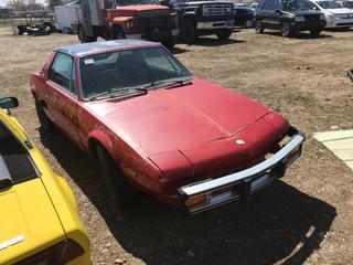 Selling Off-Site -  1977 Fiat X19 Car c/w 4 Cyl, Std, No Key,  VIN 128AS0076172. Location - 527 North 200 East, Raymond, AB -  For Further Information Please Call Chris 403-308-1161.
