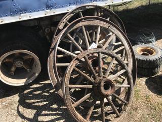 Selling Off-Site -  (2) Wood Wagon Wheels. Location - 527 North 200 East, Raymond, AB -  For Further Information Please Call Chris 403-308-1161.