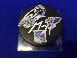 Wayne Gretzky Signed Hockey Puck w/ 4 Team Logos.