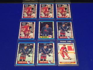 (4) 1989-90 Theoron Fleury #232 O-Pee-Chee Rookie Cards, Joe Sakic #113 Topps Rookie Card, Brian Leetch #136 Rookie Cards.