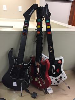 (3) Guitar Hero Guitars.