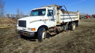 1999 International 4900 Gravel Truck C/w Manual, Diesel, Storage Cabinet. Showing 560,245kms. VIN 1HTSDAAN7XH659298 *Note: Running Condition Unknown, No Batteries, Transmission/Rear Axle Locked*