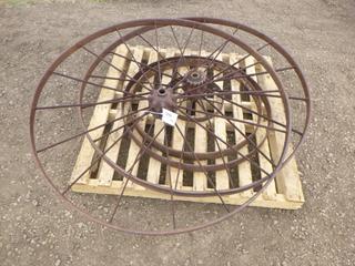 (2) 56 In. Spoked Steel Ornamental Casts, (2) 32 In. x 36 In. Steel Rings