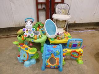 Qty of Baby Accessories Including (2) Exersaucer, Adjustable High Chair, V-Tech Drum Set, V-Tech Smart Shots, Baby Books, Mobile Bathtub and Bath Chair (S-2-1)
