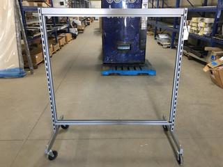 Metal Clothing Rack on Wheels.