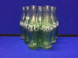 (9) 50's-60's Coca-Cola 6-1/2oz Bottles, Dual Languages.