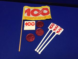 Coca-Cola 1986 100th Anniversary 10" Flag, (3) Stir Sticks, Full Booklet Paper Matches, (3) Tokens.