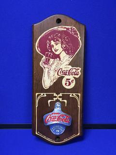 Coca-Cola Wall Mounted Bottle Opener On A Wooden Plaque.