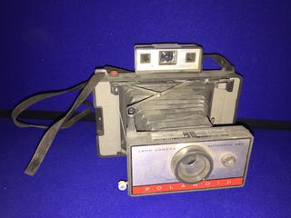 Polaroid Automatic 220 Land Camera.