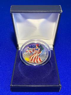 2003 USA One Ounce .999 Fine Silver Colour Printed Liberty Dollar c/w Display Case.