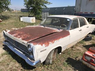 Selling Off- Site -  1967 Mercury Comet 4 Door Sedan c/w 289 V8, Auto, Running Condition Unknown, Right Front Body Damage, VIN 7H02C561976.  Location - 527 North 200 East, Raymond, AB -  For Further Information Please Call Chris 403-308-1161.