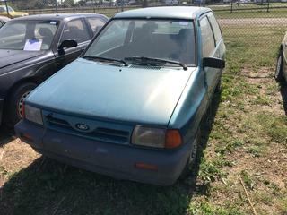 Selling Off- Site -  1993 Ford Festiva c/w 4 Cyl, Auto, Showing 252,819 Kms, VIN KNJBT05H8P6117425.  Location - 527 North 200 East, Raymond, AB -  For Further Information Please Call Chris 403-308-1161.