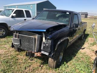 Selling Off- Site -  1998 GMC 1500 Extended Cab 4x4 c/w V8, Auto, Salvage, Missing Parts, Running Condition Unknown, Showing 223,198 Kms, VIN 2GCEK19R9W1254018.  Location - 527 North 200 East, Raymond, AB -  For Further Information Please Call Chris 403-308-1161.
