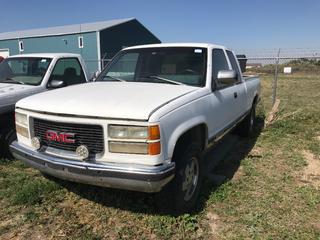 Selling Off- Site -  1990 GMC 1500 Extended Cab 4x4 c/w V8, Auto, Rebuilt Status, Showing 172,137 Kms, VIN 2GTEK19K8L1556737.  Location - 527 North 200 East, Raymond, AB -  For Further Information Please Call Chris 403-308-1161.
