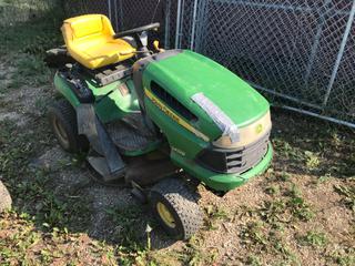 Selling Off- Site -  John Deere LA100 Lawn Tractor Running Condition Unknown.  Location - 527 North 200 East, Raymond, AB -  For Further Information Please Call Chris 403-308-1161.