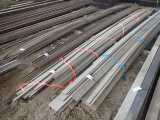 Quantity of Assorted Size Approx. Lengths of Steel Flat Bar, Widths From 2" to 3 1/2",  Thickness 1/4", 3/8" & 1/2". Note:  Lot Only Includes Steel Marked with Orange Ribbon.