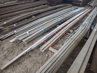 Quantity of Steel Bar c/o 20'x4"x1/4", 20'x4"x1/2", 20'x6"x3/8", 20'x4 3/4"x3/4" & (1) 26'x4 3/4"x3/4" All Approximate. Note:  Lot Only Includes Steel Marked with Orange Ribbon.