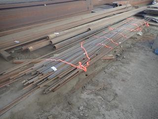 Quantity of Assorted Up to 20' Lengths of Steel Rod, Thickness 1/2", 3/4", 1" and 1 1/4". Note:  Lot Only Includes Steel Marked with Orange Ribbon.