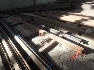 Quantity of (12) Sections of Steel Flat Bar Approx. 20'x5"x3/8". Note: Lot Only Includes Steel Marked with Orange Ribbon.