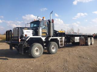 2007 Kenworth C500B T/A T/A Bed Truck c/w CAT C15, 475 ACERT, Eaton RTLO18918B Transmission w/ AT1202 Aux, Showing 122,164 Kms, 2,207 Hours, FR2P-32-S Rears, 9 Ft. 6 In. x 30 Ft. Bed, (2) Braden Hyd Winches, Flip Over 5th, Hyd Lift Gin Poles, Hyd Chock Blocks, (2) Air Lift Kickers, Live Roll, Headache Rack, Side Storage, Double Lock Ups, 384 In. W/B, Front Tires at 70%, Rear Tires at 75%, CVIP 10/2021, VIN 1NKCXBTX97R990132