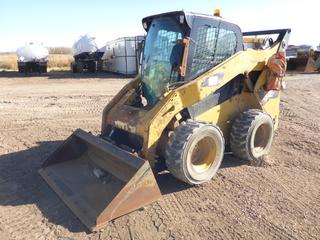 2012 CAT 262C2 Two Speed Skid Steer c/w Q/A Bucket, Showing 15,715 Hours, Aux Hyd, A/C Cab, Ride Control, 12-16.5 Tires at 35%, SN CAT0262CPTMW00890 *Note: Door Handle Missing* (PL0180)