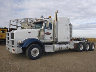 2014 Peterbilt 367 Tri-Drive Truck Tractor c/w Cummins ISX15 550 HP Diesel, 18 Speed Transmission, Showing 570,975 Kms, 24,001 Hours, 63 In. Sleeper, 267 In. W/B, Front Axle Rating 16,001 Lb, Rear Axle Rating 60,999 Lb, Wet Kit, Auto Slide 5th Wheel, Triple Lock Ups, CVIP 12/2021, VIN 1XPTP4EX3ED241197. *Note: DEF Deleted*