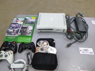 Xbox 360 w/ Cords, C/w (4) Xbox one Games, (1) Xbox 360 Game, (1) Wii Game, (2) 360 Controllers, (1) Xbox 360 Wi-Fi Adapter, (1) PSP Case w/ (11) Games