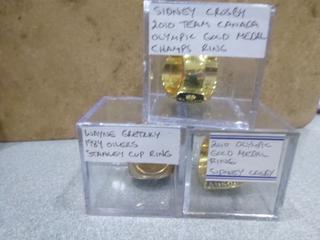 (2) 2010 Sidney Crosby Canada Olympic Gold Medal Replica Ring,  (1) 1984 Wayne Gretzky Stanley Cup Replica Ring (Office)