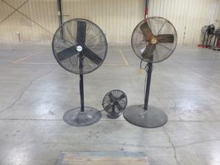 (2) Industrial Pedestal Fans With (1) Small Table Top Fan