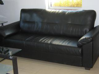 (2) Vinyon/Pleather Couches, 69 In. x 34.5 In. x 36 In., (2) Vinyon/Pleather Chairs, 30.5 In. x 28 In. x 25 In., (1) Glass Top Coffee Table, 23.5 In. x 43 In. x 17.5 In., (1) Glass Top End Table, 19.75 In. x 19.75 In. x 23.5 In., (1) Glass Top Console/Sofa Table 15.75 In. x 43.25 In. x 29.25 In.