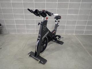 Star Trac Spinner Blade Spin Bike. SN SBEX1311-L01059 *Note: This Item Is Located At 7103 68AVE NW- Location 2*